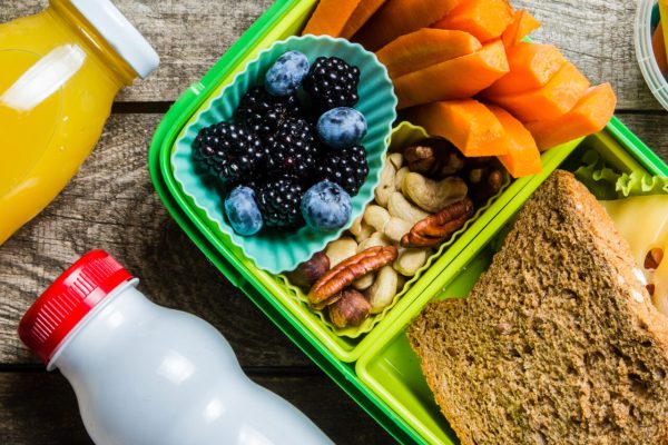 Healthy school lunch box on rustic background, copy space