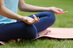 Woman do yoga at the park