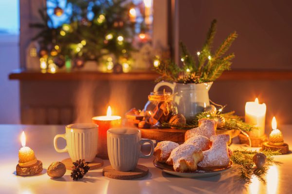 two cups of tea with homemade christmas baked goods on kitchen w two cups of tea with homemade christmas baked goods on kitchen with christmas decoration